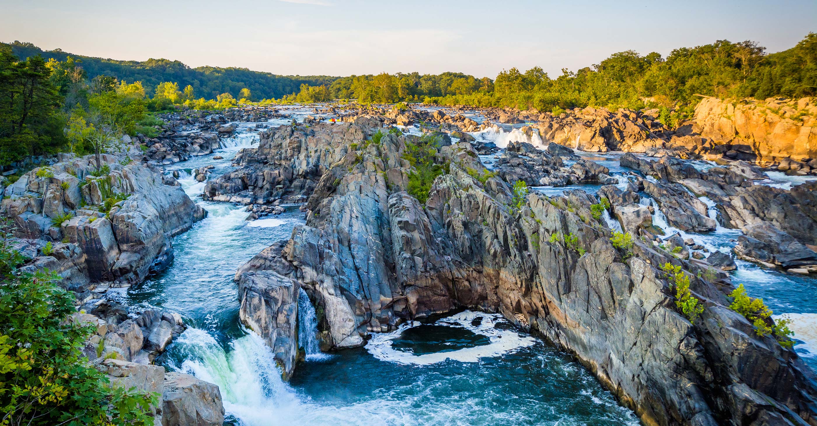 View of rapids in the Potomac River at sunset, at Great Falls Park, Virginia.
