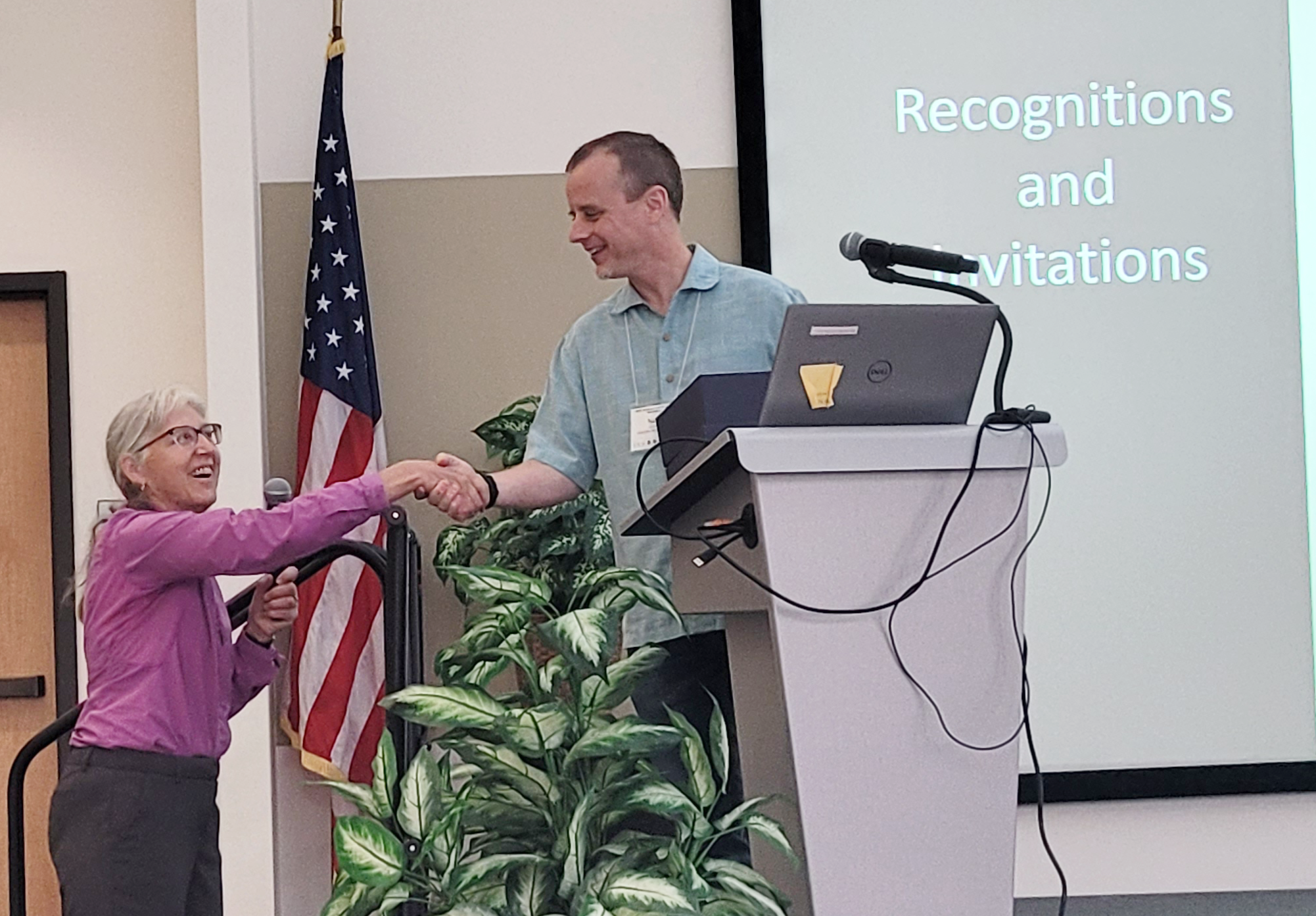Marina Skumanich presents Tyson Ochsner with the Soil Moisture Community Award at the 2023 National Soil Moisture Workshop.