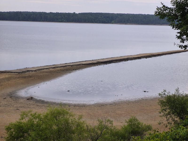 Photo of Jordan Lake in North Carolina, which has dropped significantly amid the area’s worst drought since 2007-08. The lake is below its target storage with broad areas of shoreline visible and boating hazards exposed.