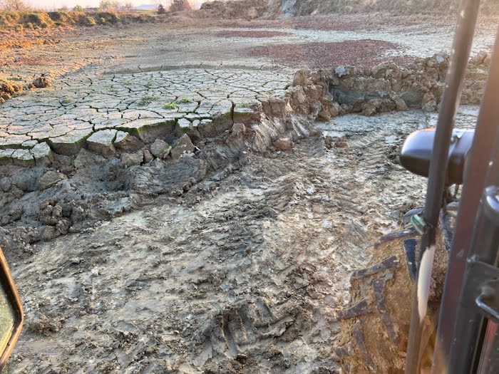 Surface pond conditions in Montgomery County, Kentucky are completely dried out, showing dry, cracked earth.