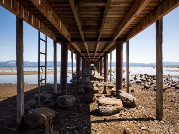 A bridge standing among low water levels at Lake Tahoe