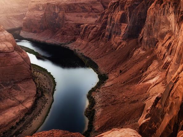 The Colorado River with low water levels, representing drought in the Southwest.