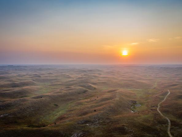 Hazy sunrise over Nebraska Sandhills, representing public health impacts of drought. Photo credit: marekuliasz, Shutterstock.