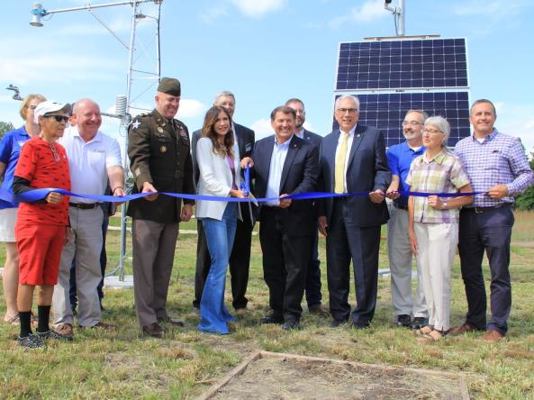 Attendees cut a ribbon to celebrate the expansion of the Mesonet at SDState