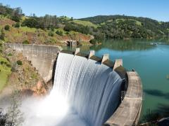 Water spills over the top of Englebright Dam on the Yuba River. Photo credit: Gary Saxe/Shutterstock.