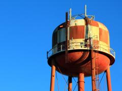 A water tower represents the water utilities sector.