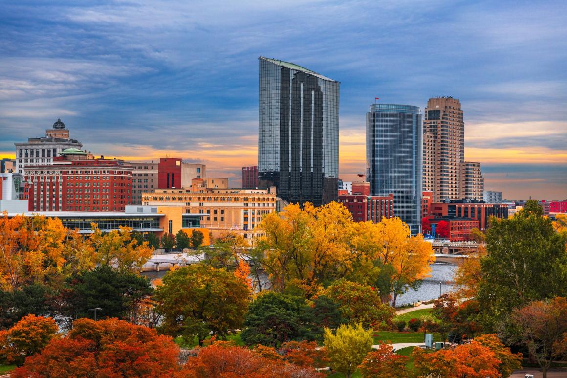 Downtown skyline of Grand Rapids, Michigan, with fall foliage in the foreground. Photo credit: SeanPavonePhoto, Adobe Stock.