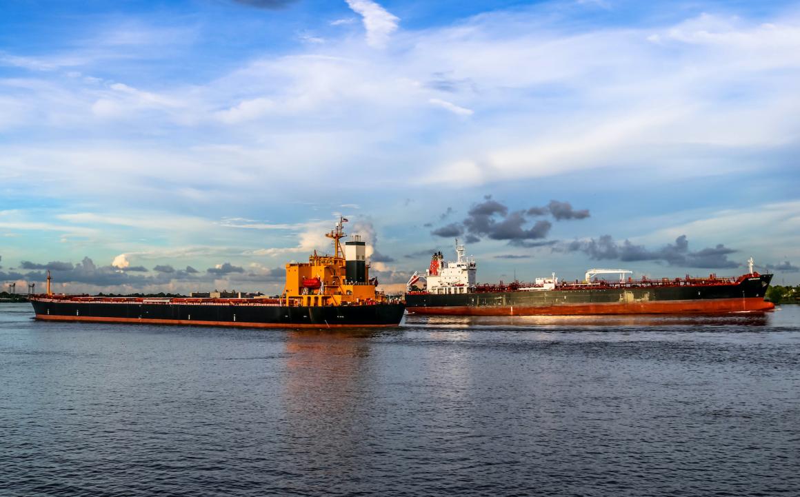 Two barges on the Mississippi River, where drought and low water levels have impacted shipping. Credit: Christopher P, Shutterstock.