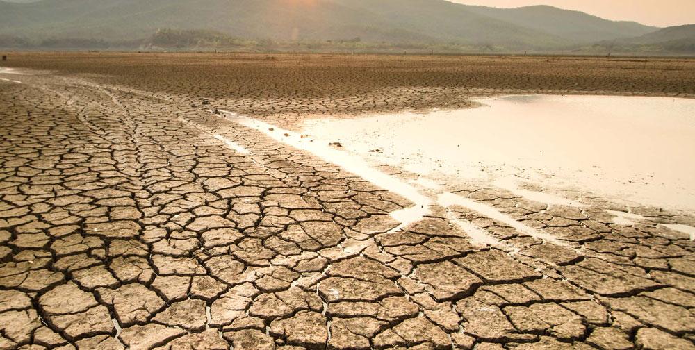 Dried out riverbed with dry, cracked soil