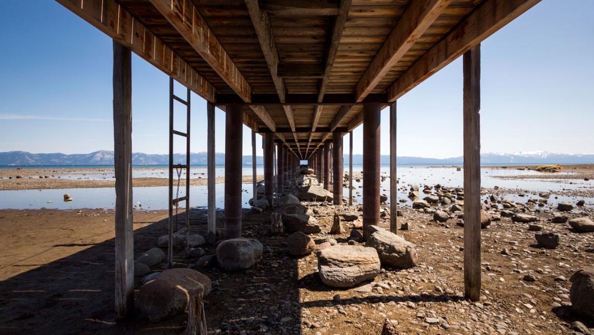 A bridge standing among low water levels at Lake Tahoe