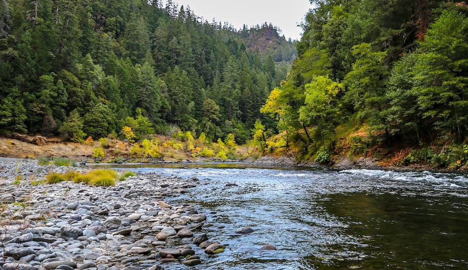 Water flowing in the Rouge River in Oregon in the fall.
