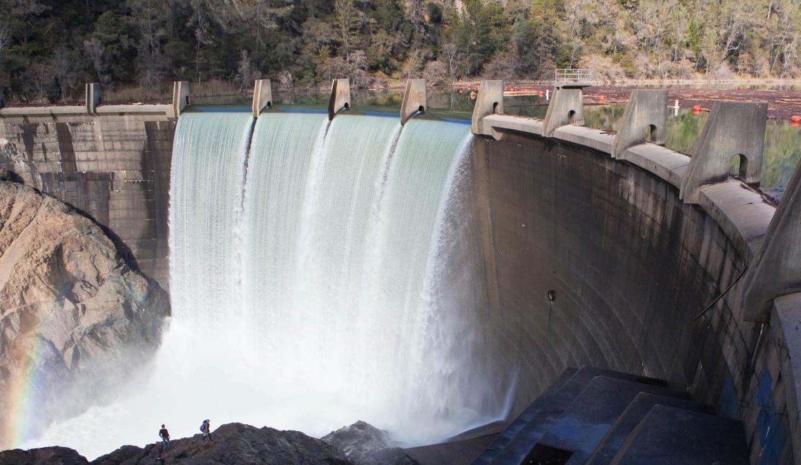 Water flowing through a dam