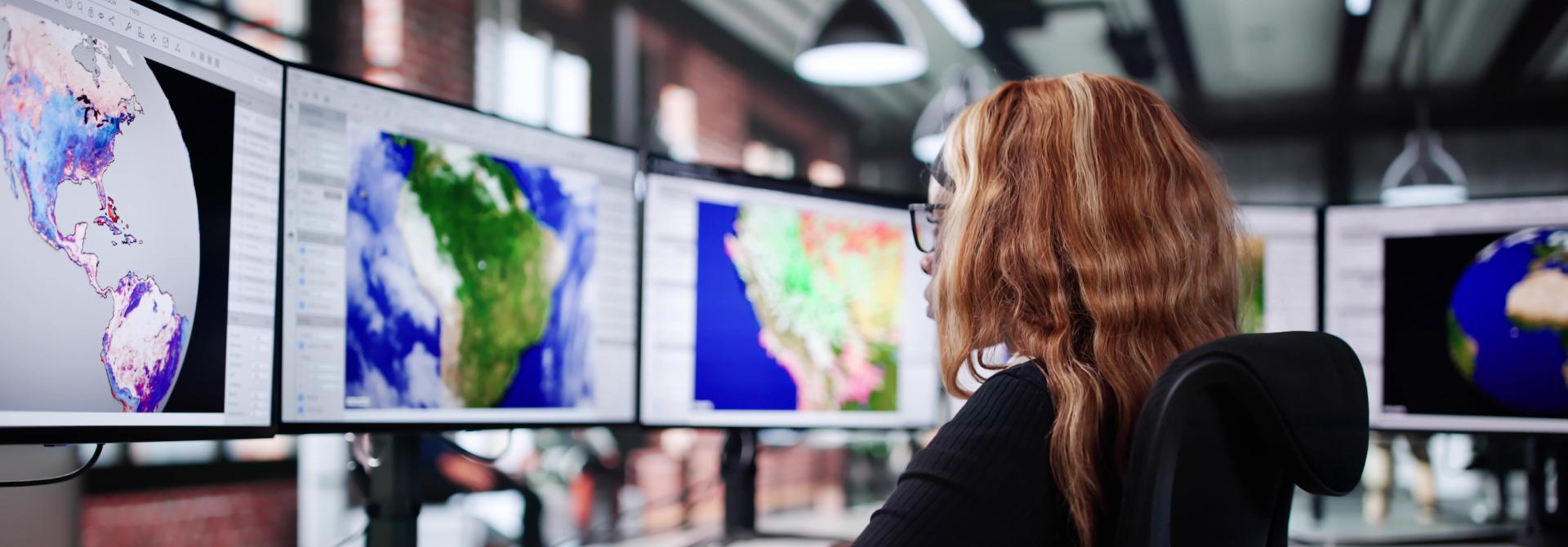 Professional Meteorologist Analyzing Climate Science Data. Photo credit: Andrey Popov, Adobe Stock.