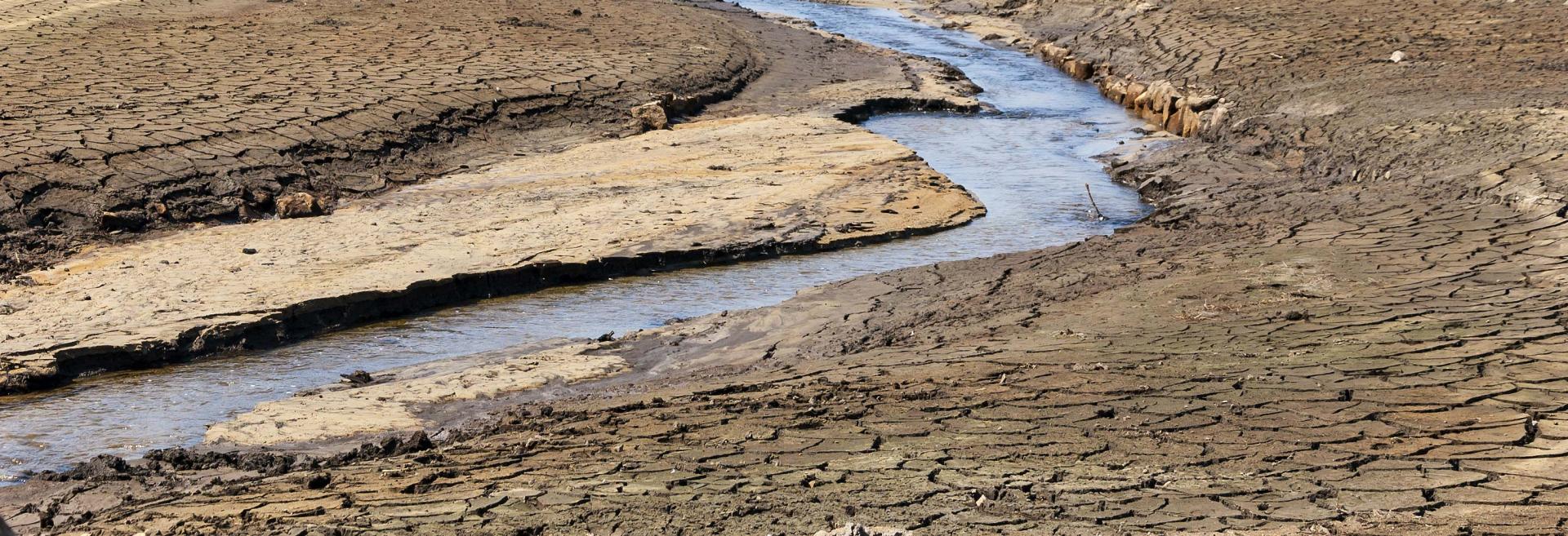 A river with dried and cracked soil