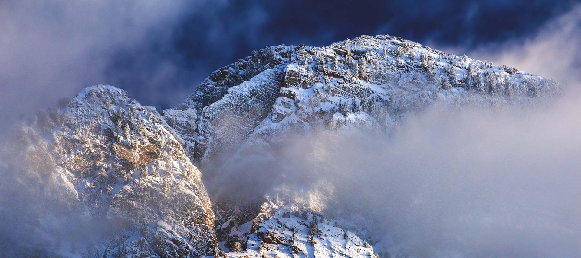 Winter snow and fog cling to Mount Timpanogos in the Wasatch Front mountains