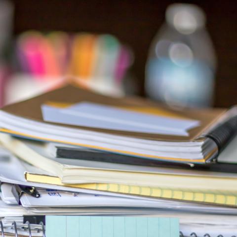 A stack of books and notebooks