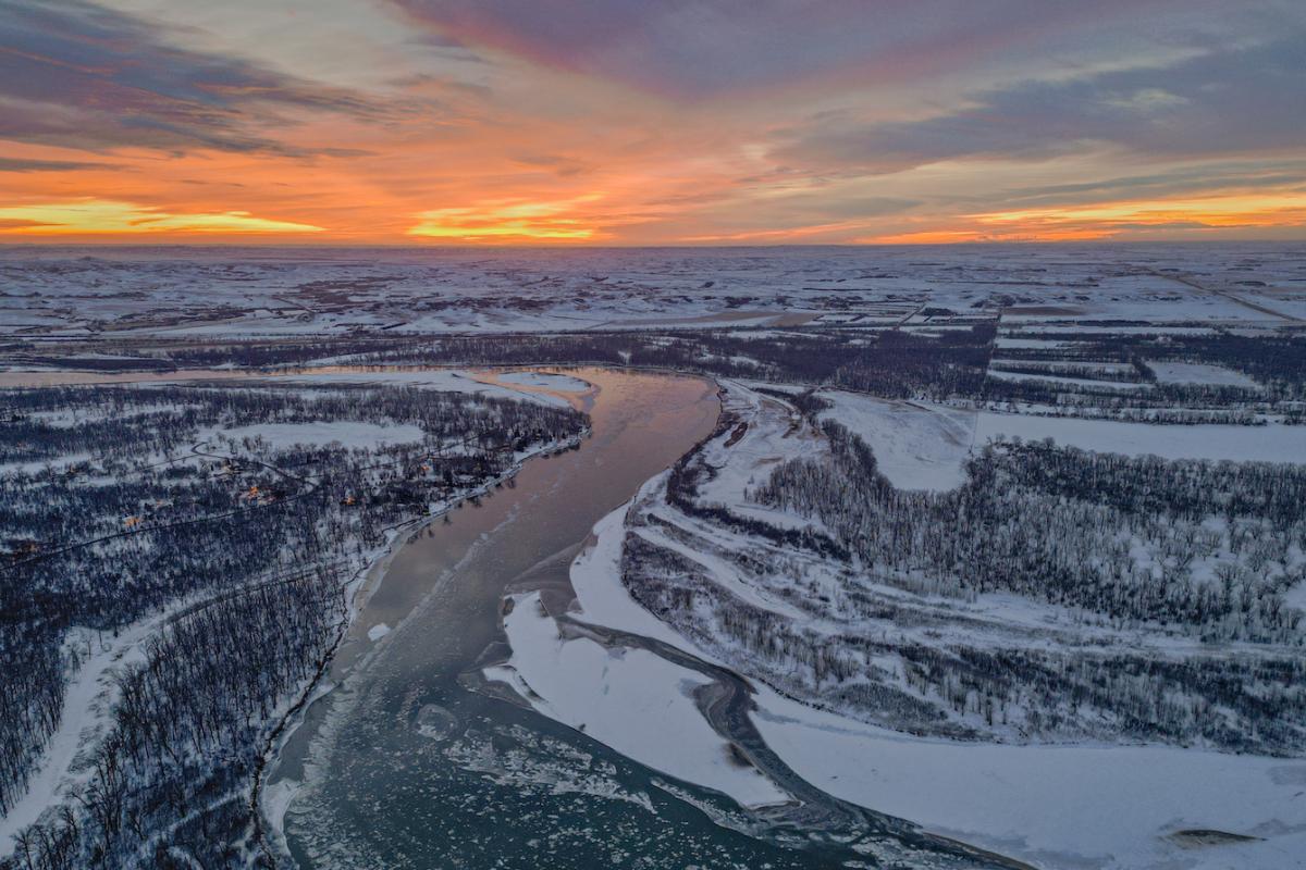 A winter sunset over the Missouri River in Montana. Photo credit: Cordell, Adobe Stock.